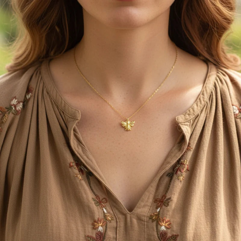 Gold butterfly necklace with intricate detailing and delicate chain, perfect for the Golden Bumblebee Spirit collection