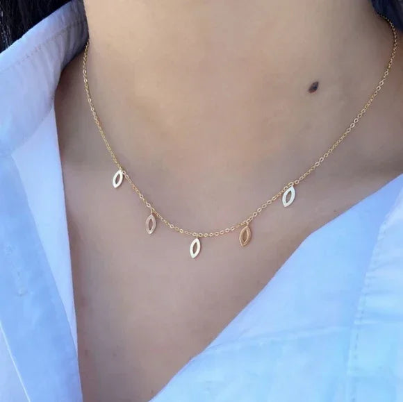 Almond Cutouts Gold Necklace featuring six small open leaf-shaped charms