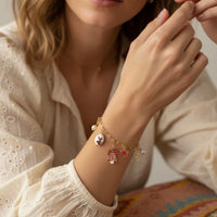 Festive Charm Christmas bracelet with gold, red, white, blue accents