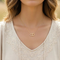 Dainty interlocking circles pendant necklace with lace blouse