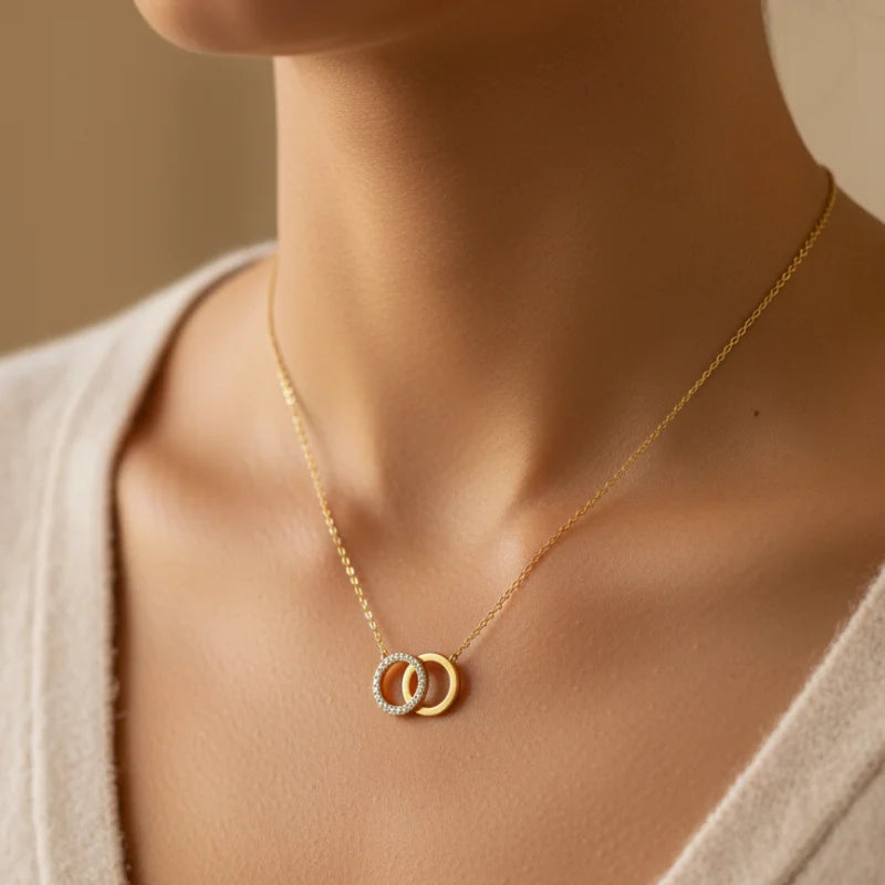 Dainty gold interlocking circles pendant necklace with diamond accents