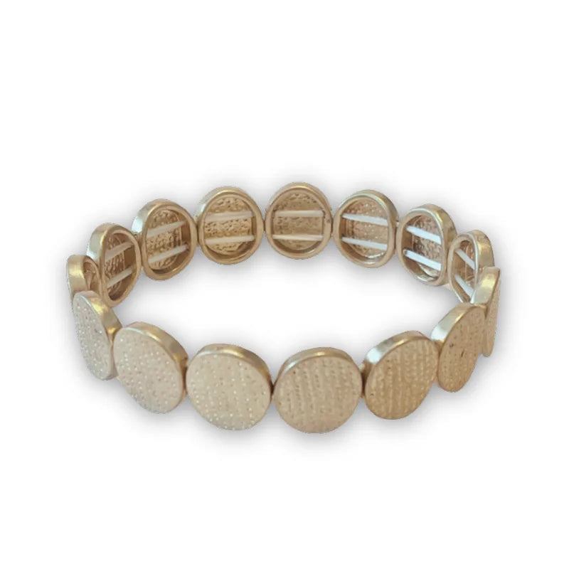 Matte gold tone textured disc stretch bracelet with engraved text