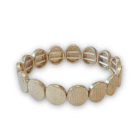 Matte gold tone textured disc stretch bracelet with engraved text