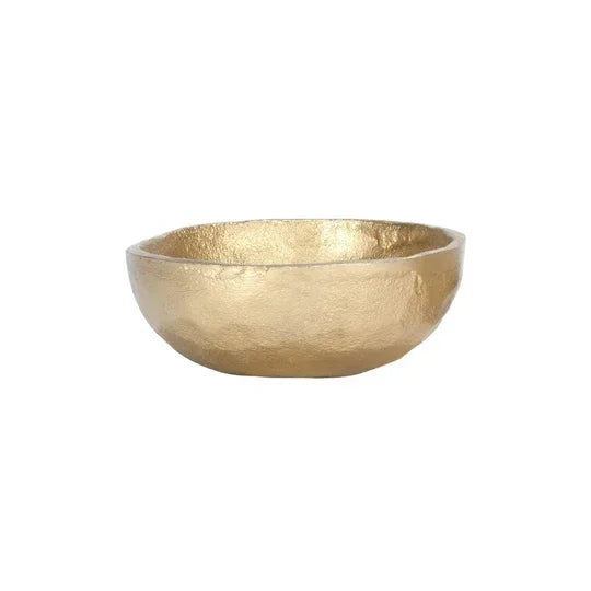 Gold-colored decorative aluminum bowl in a flowy boho style for free spirit decor