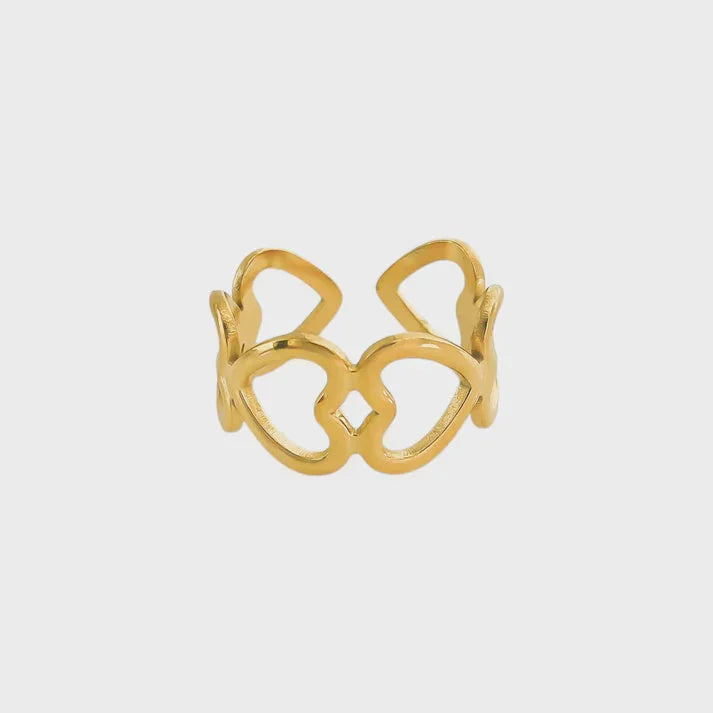 Water resistant gold adjustable ring with heart cutouts and diamond pattern design