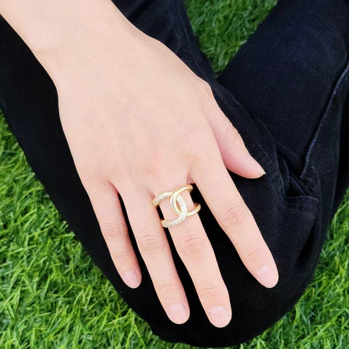 Gold-colored CZ Ring with interlocking C design and pavé rhinestones, perfect for women’s boho chic clothing