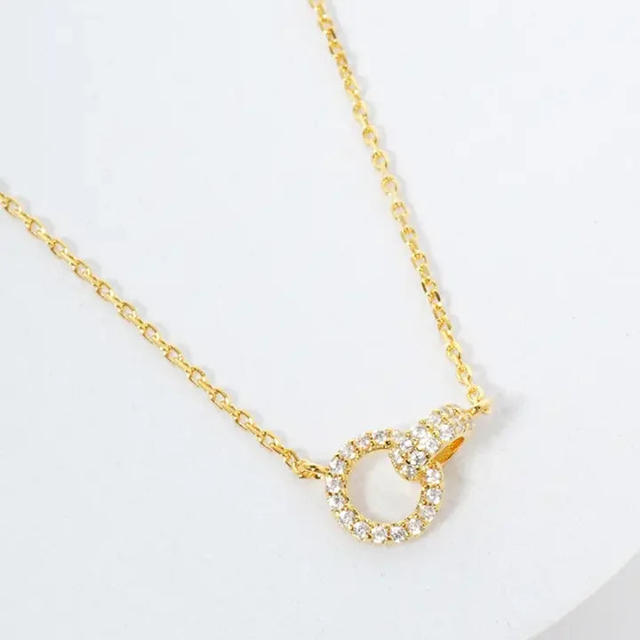 Gold dipped bohemian interlocking strength necklace with diamond circle design