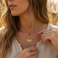 Gold dragonfly pendant necklace with blue gemstone ring set for women’s boho chic clothing