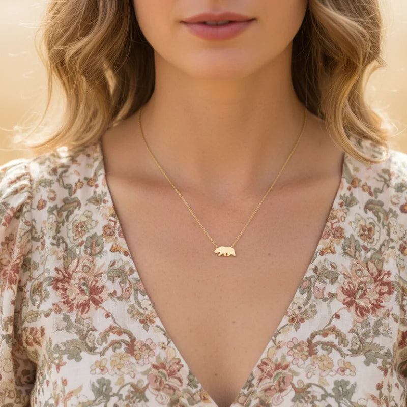 California bear pendant necklace with gold elephant design