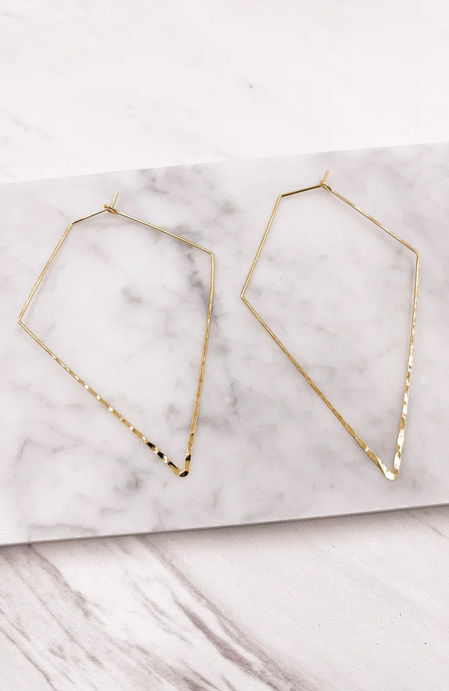 Gold geometric hoop earrings showcased alongside Hammered Triangle Earrings