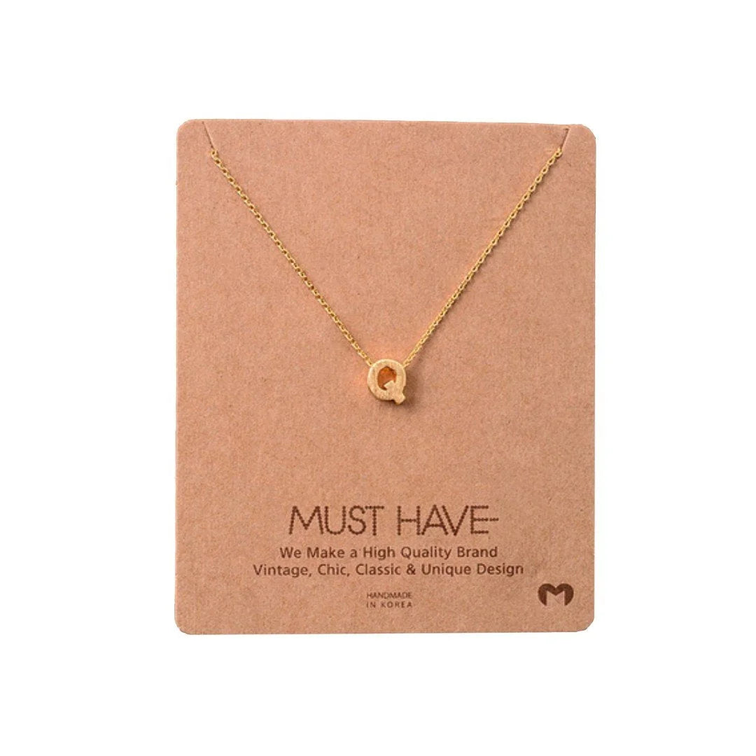 Gold Heart Necklace from Daisy Lane, a stunning Initial Q Gold piece for elegant layering