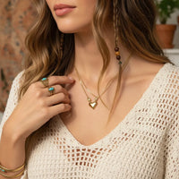 Dainty golden heart necklace with turquoise ring and wooden bracelet