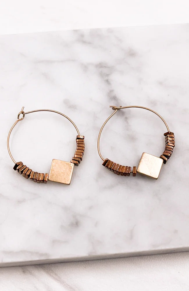 Elegant beaded gold hoops showcasing exquisite craftsmanship and timeless style