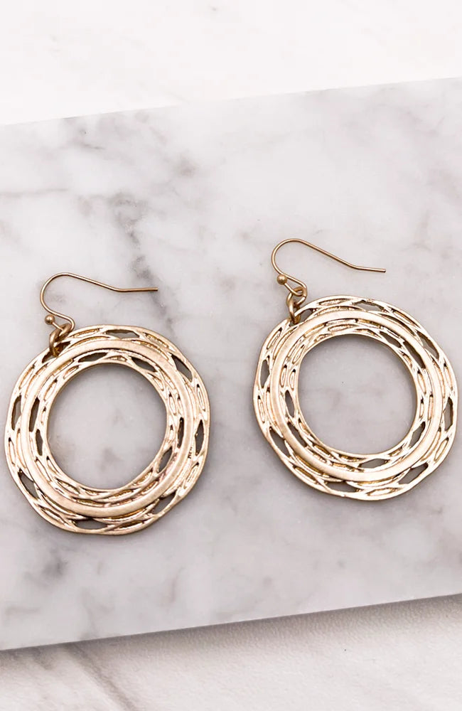 Braided Gold Hoop Earrings elegantly displayed, showcasing intricate design and shine