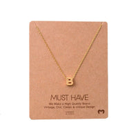 Gold Initial B Necklace displayed on a card from Daisy Lane’s dainty initial necklaces