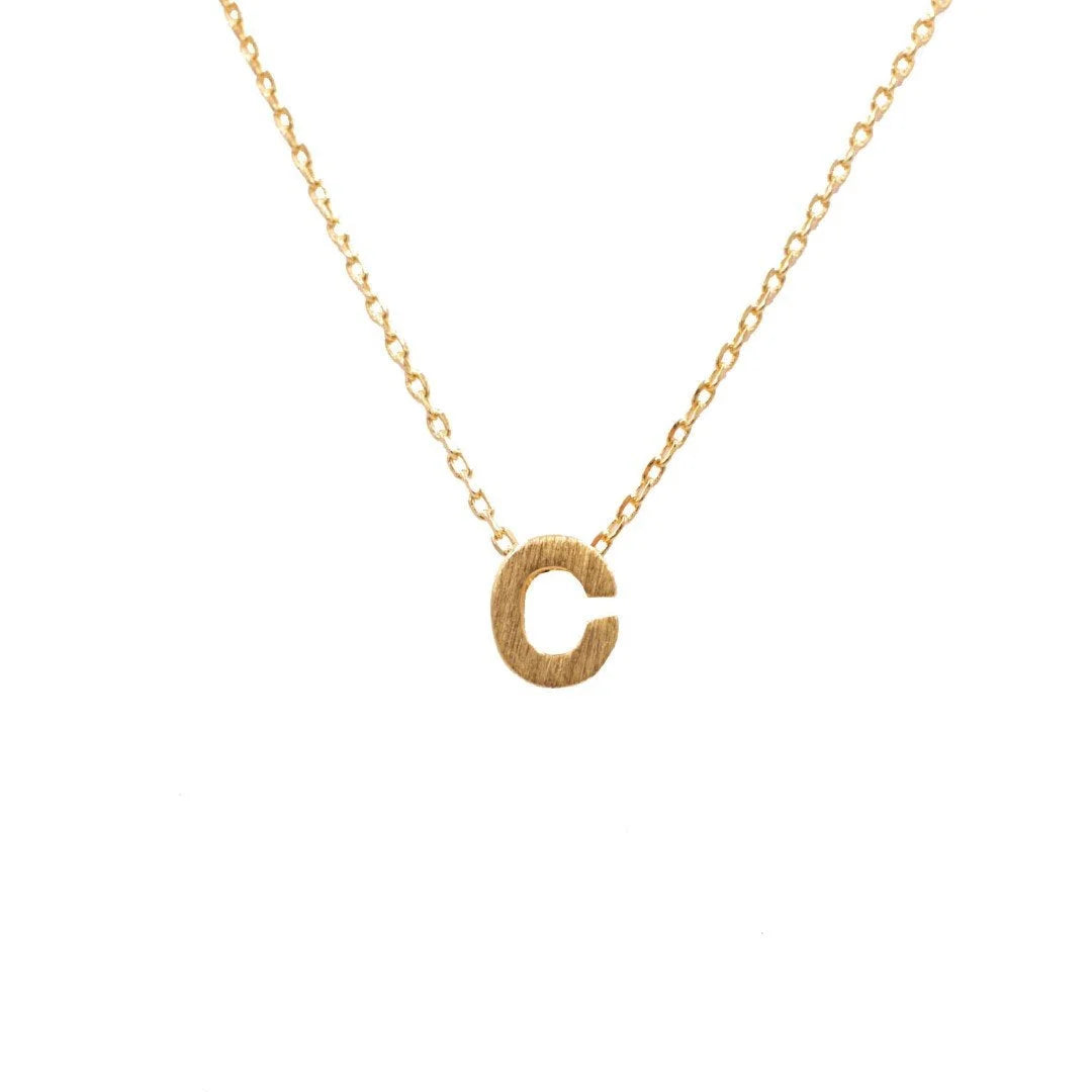 Dainty Initial C Gold Necklace from Daisy Lane, showcasing elegant personal style