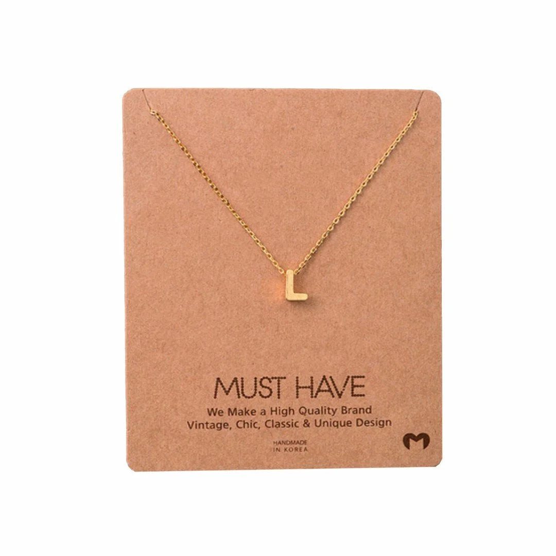 Dainty Initial L Gold Necklace from Daisy Lane displayed elegantly on a neutral background