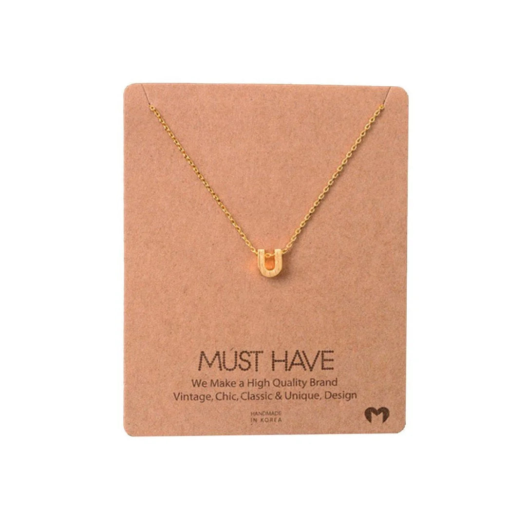 Dainty Initial U Gold Necklace from Daisy Lane showcased elegantly