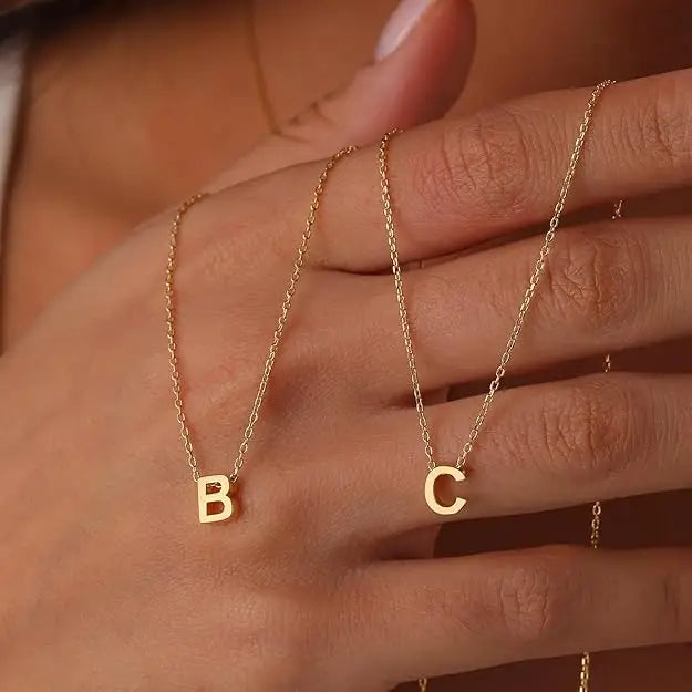 Gold initial necklaces in dainty personalized jewelry for elegant style