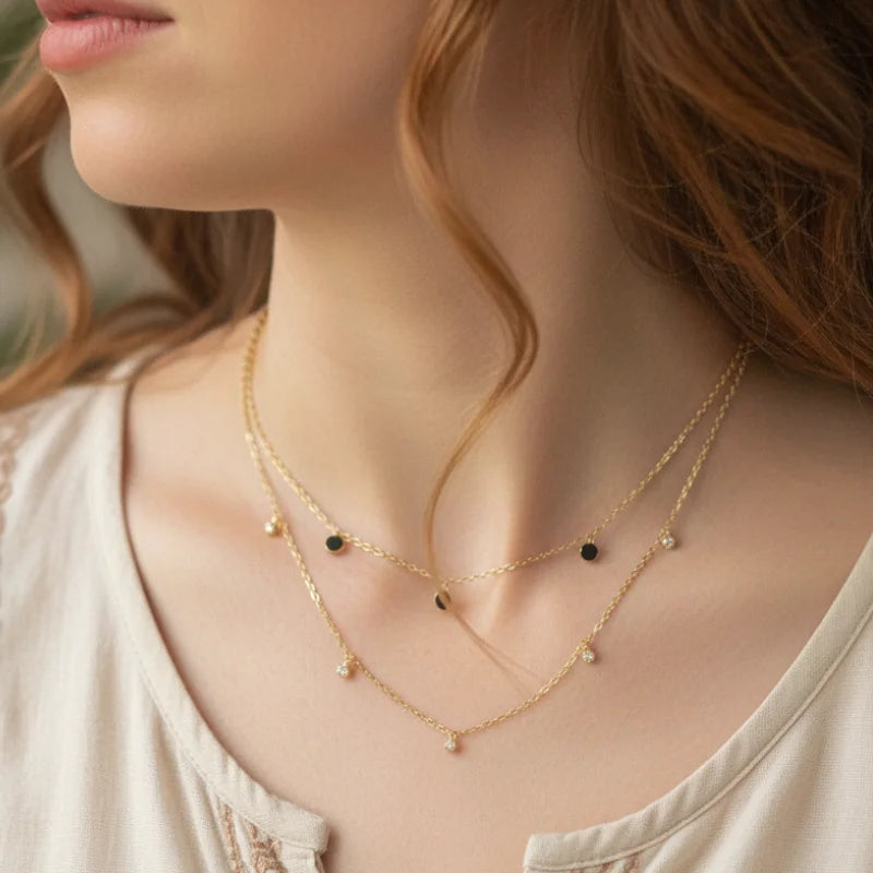 Golden earthy spirit layered necklace with black beads and small pendants