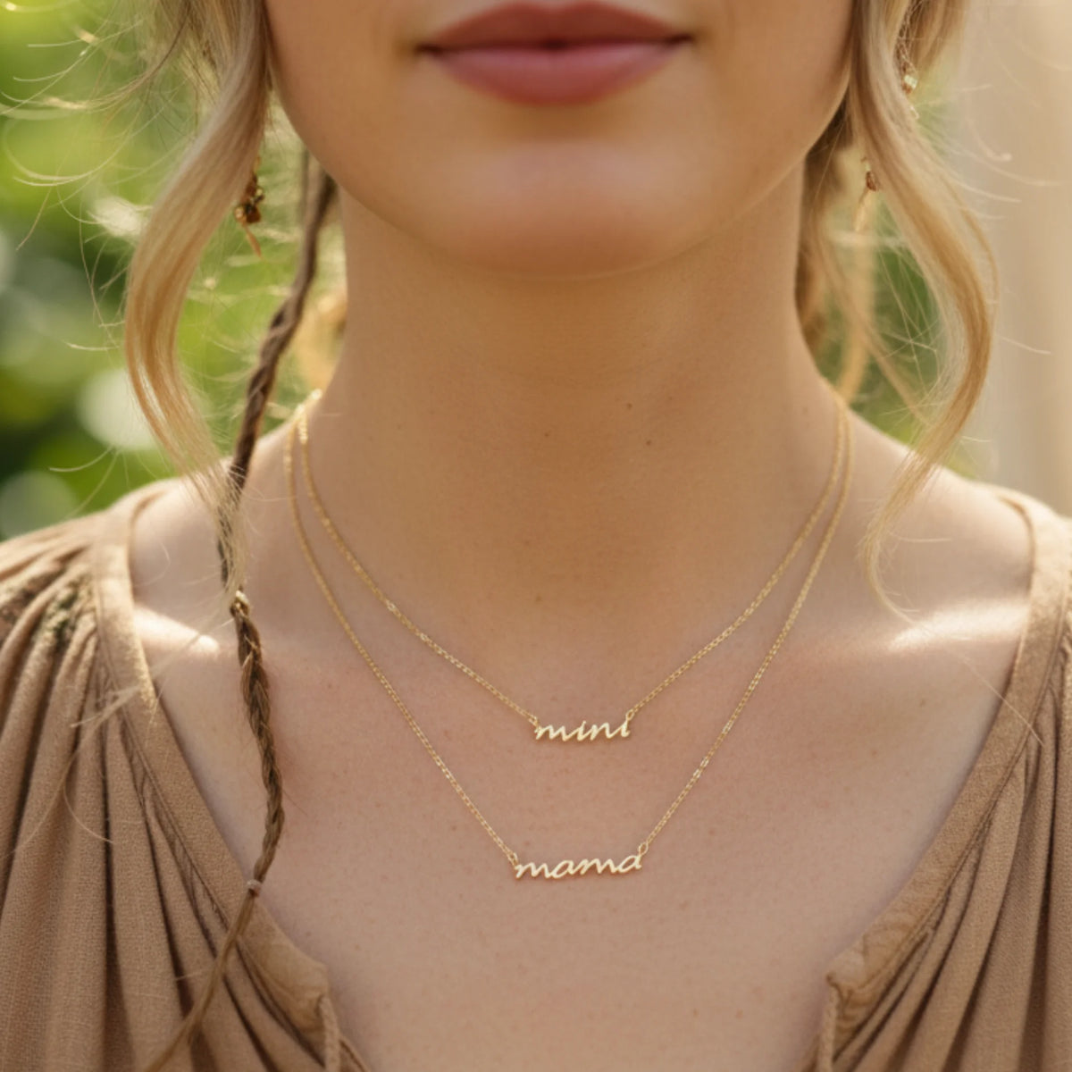 Gold dipped necklace with mini and Mama inscriptions from the Mama Mini Gold Dipped Necklace Set