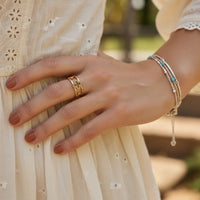 Bohemian adjustable gold clover ring with turquoise accents and beaded details