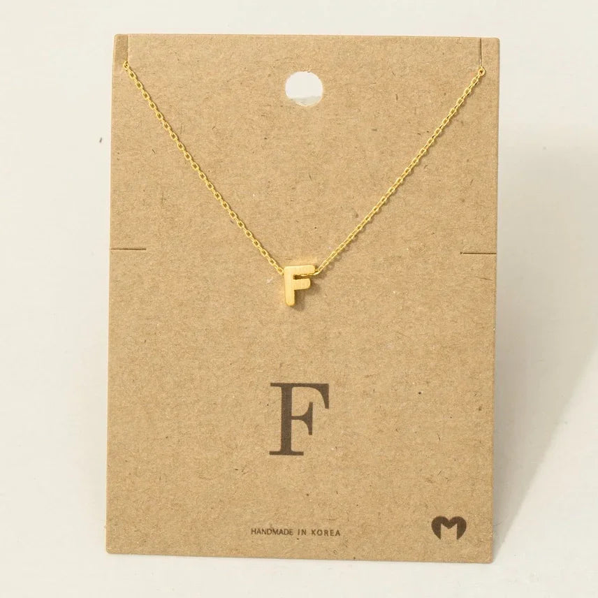 Gold letter F necklace with a delicate chain from personalized dainty jewelry collection