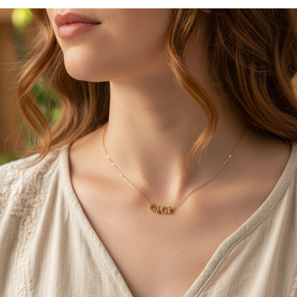 Gold letter necklace from GIGI GOLDEN SPIRIT collection showcasing elegant design