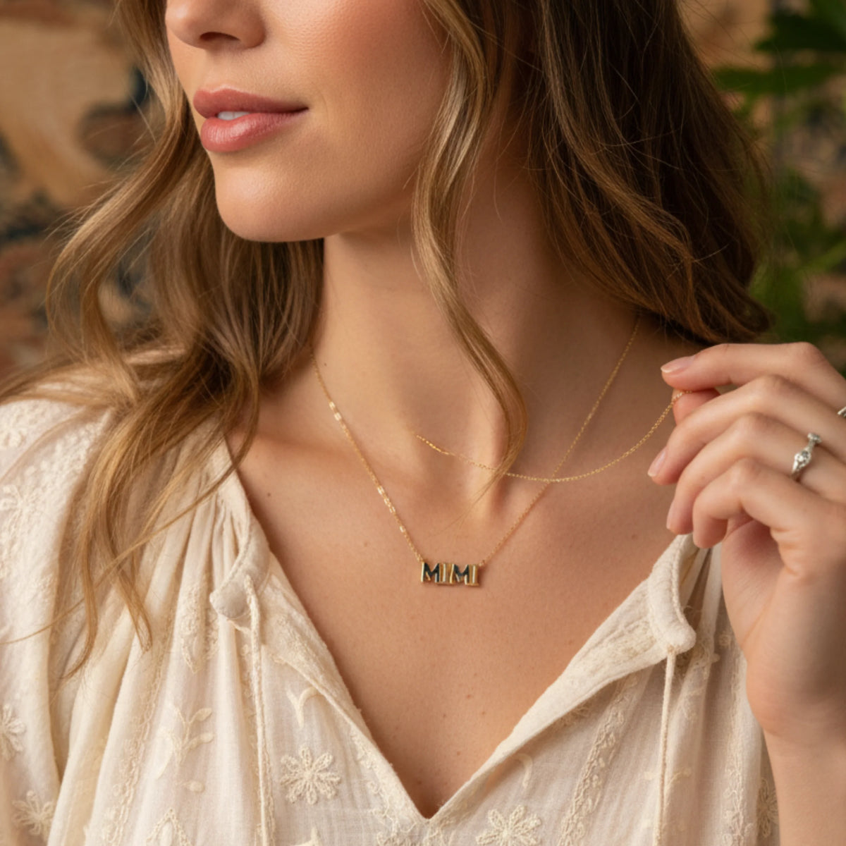 Gold dipped Mimi charm necklace with a delicate chain and small pendant for elegant style