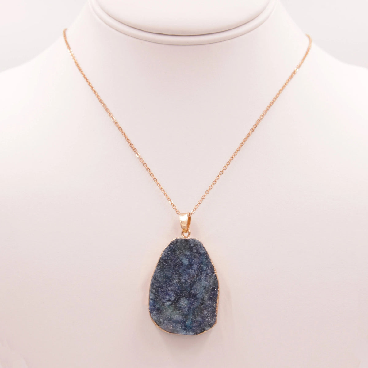 Gold necklace featuring a blue quartz genuine stone pendant in elegant design