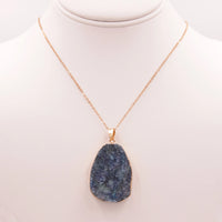 Gold necklace featuring a blue quartz genuine stone pendant in elegant design