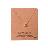 Dainty Initial O Gold Necklace displayed elegantly on a card by Daisy Lane