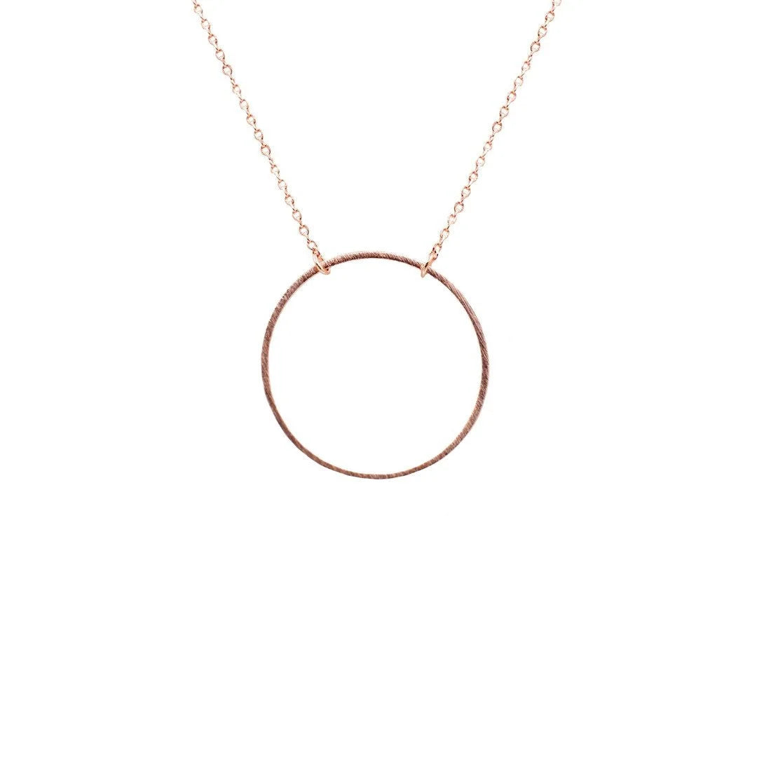 Gold circular pendant necklace featuring an elegant circle pendant design