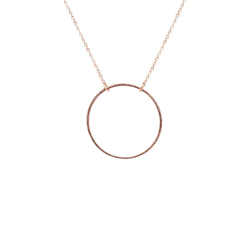 Gold circular pendant necklace featuring an elegant circle pendant design