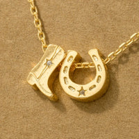 Gold dipped cowboy boots and horseshoe charm necklace, a trendy horse shoe charm necklace accessory