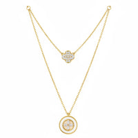 Boho gold layered charm necklace with diamond accents and central stone pendant