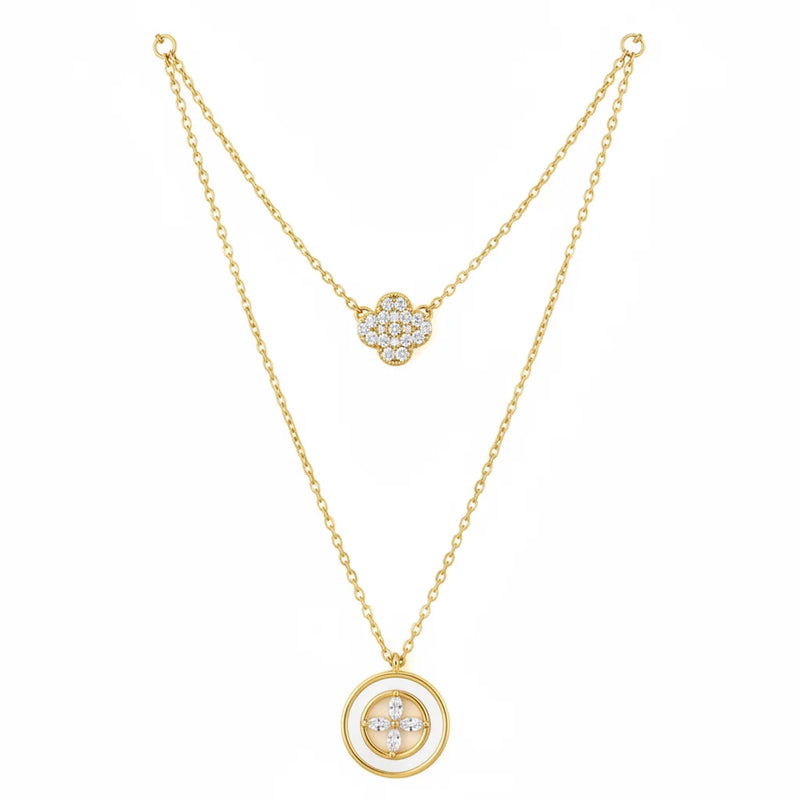 Boho gold layered charm necklace with diamond accents and central stone pendant