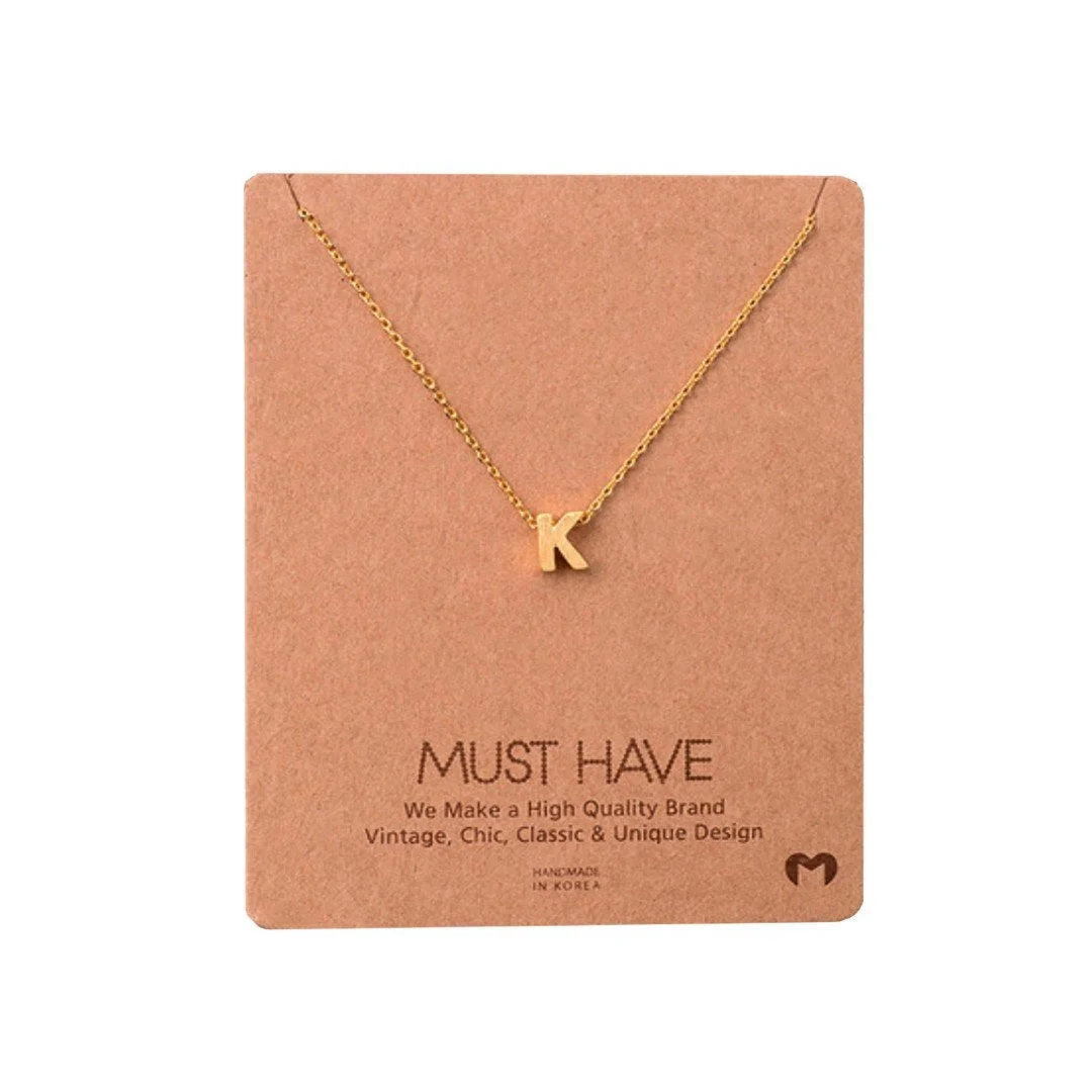 Gold INITIAL K necklace with heart charm, a stylish piece from Daisy Lane’s dainty initial necklaces