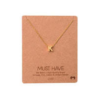 Gold INITIAL K necklace with heart charm, a stylish piece from Daisy Lane’s dainty initial necklaces