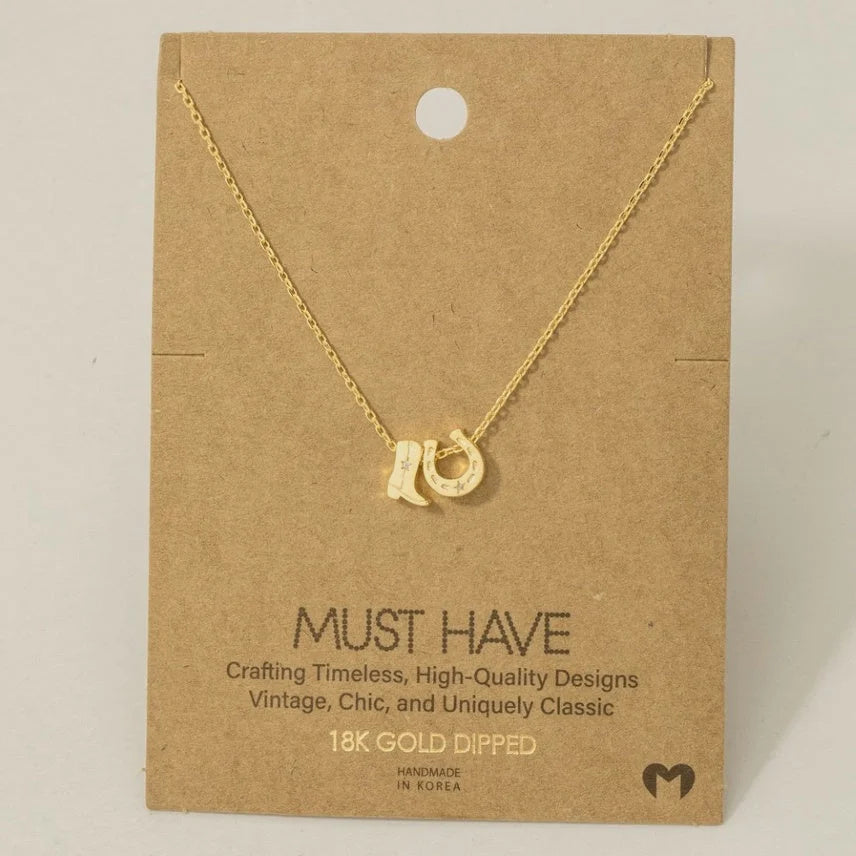 Gold dipped cowboy boots and horse shoe charm necklace featuring trendy design