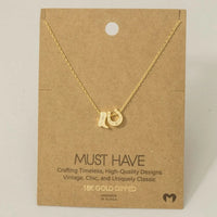 Gold dipped cowboy boots and horse shoe charm necklace featuring trendy design