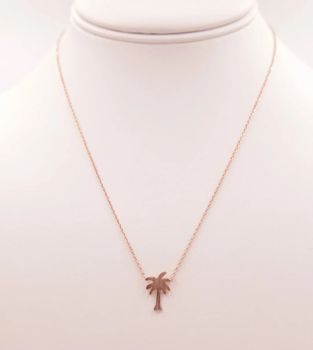 Gold Dainty Palm Tree Necklace featuring a delicate palm tree pendant design