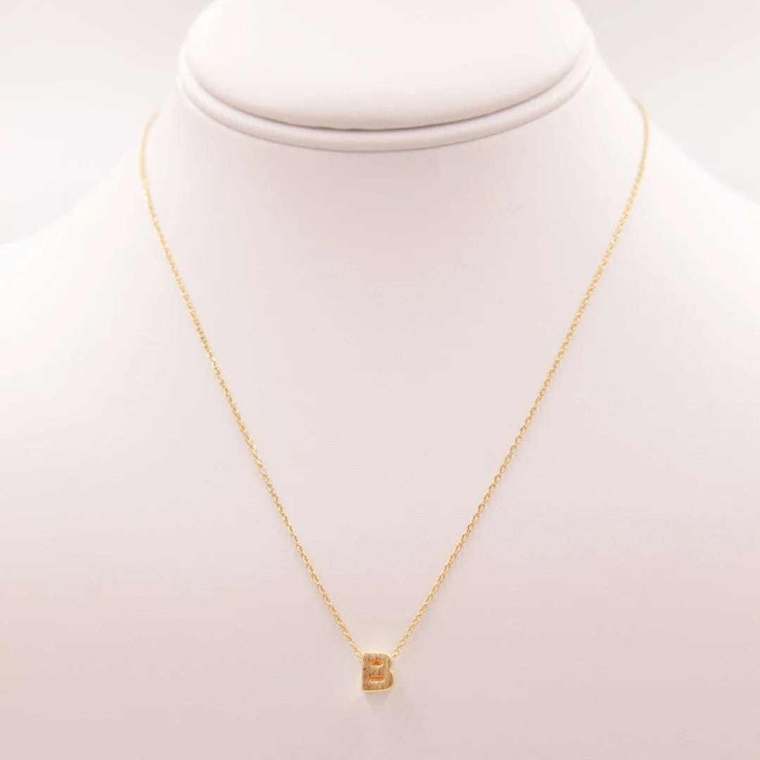 Dainty Initial B Gold Necklace with a small square-shaped pendant from Daisy Lane