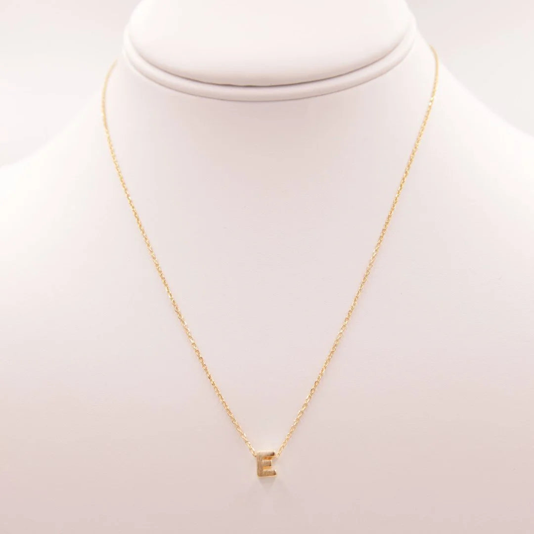 Dainty Initial E Gold Necklace with Diamond from Daisy Lane, showcasing elegance and style