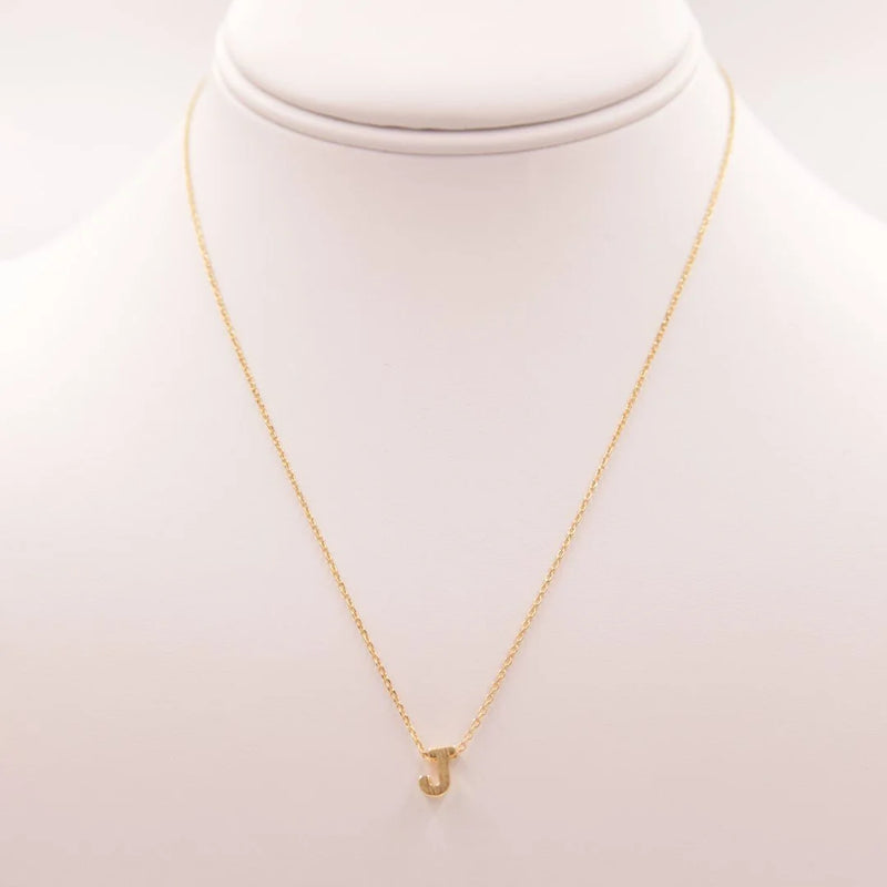 Dainty Initial J Gold Necklace from Daisy Lane featuring a gold chain and small diamond