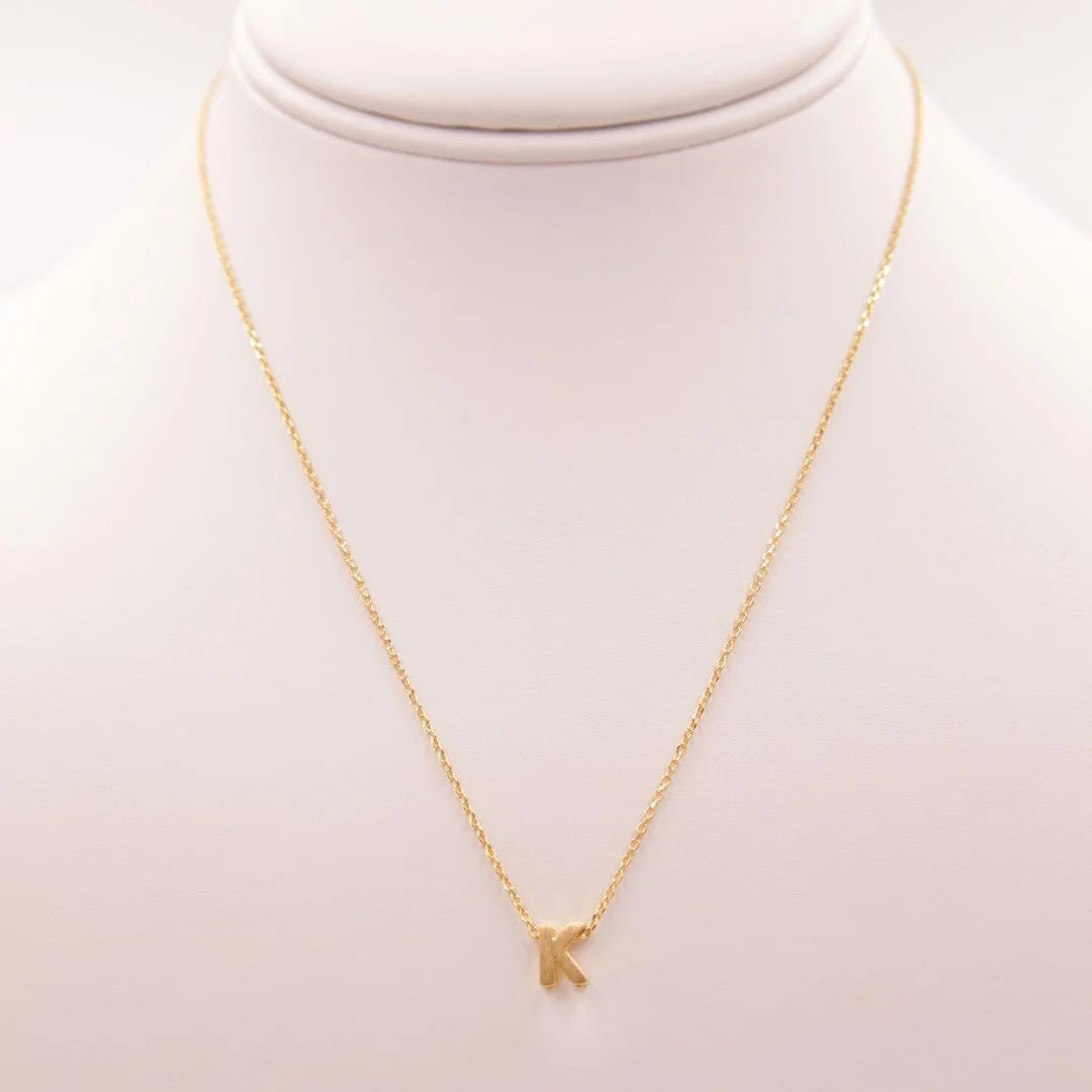 Dainty Initial K Gold Necklace with a small gold arrow by Daisy Lane