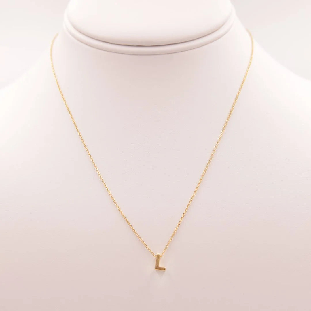 Gold INITIAL L necklace from Daisy Lane, a perfect example of dainty initial jewelry