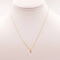 Gold INITIAL L necklace from Daisy Lane, a perfect example of dainty initial jewelry