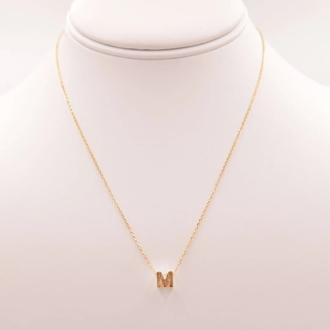 Daisy Lane Initial M Gold Necklace featuring a delicate letter charm on a gold chain