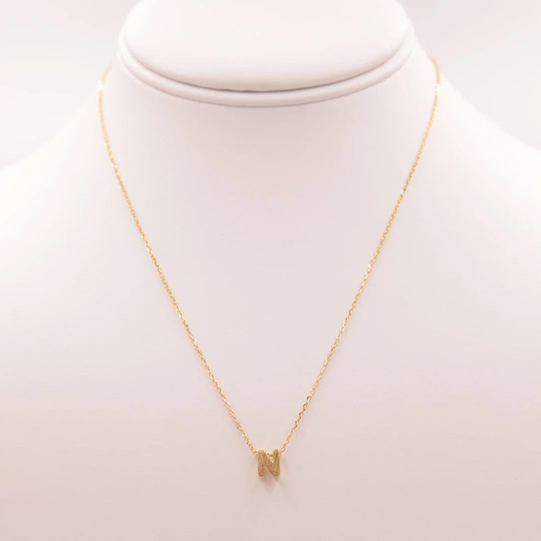 Dainty Initial N Gold Necklace with a small diamond, perfect from Daisy Lane collection